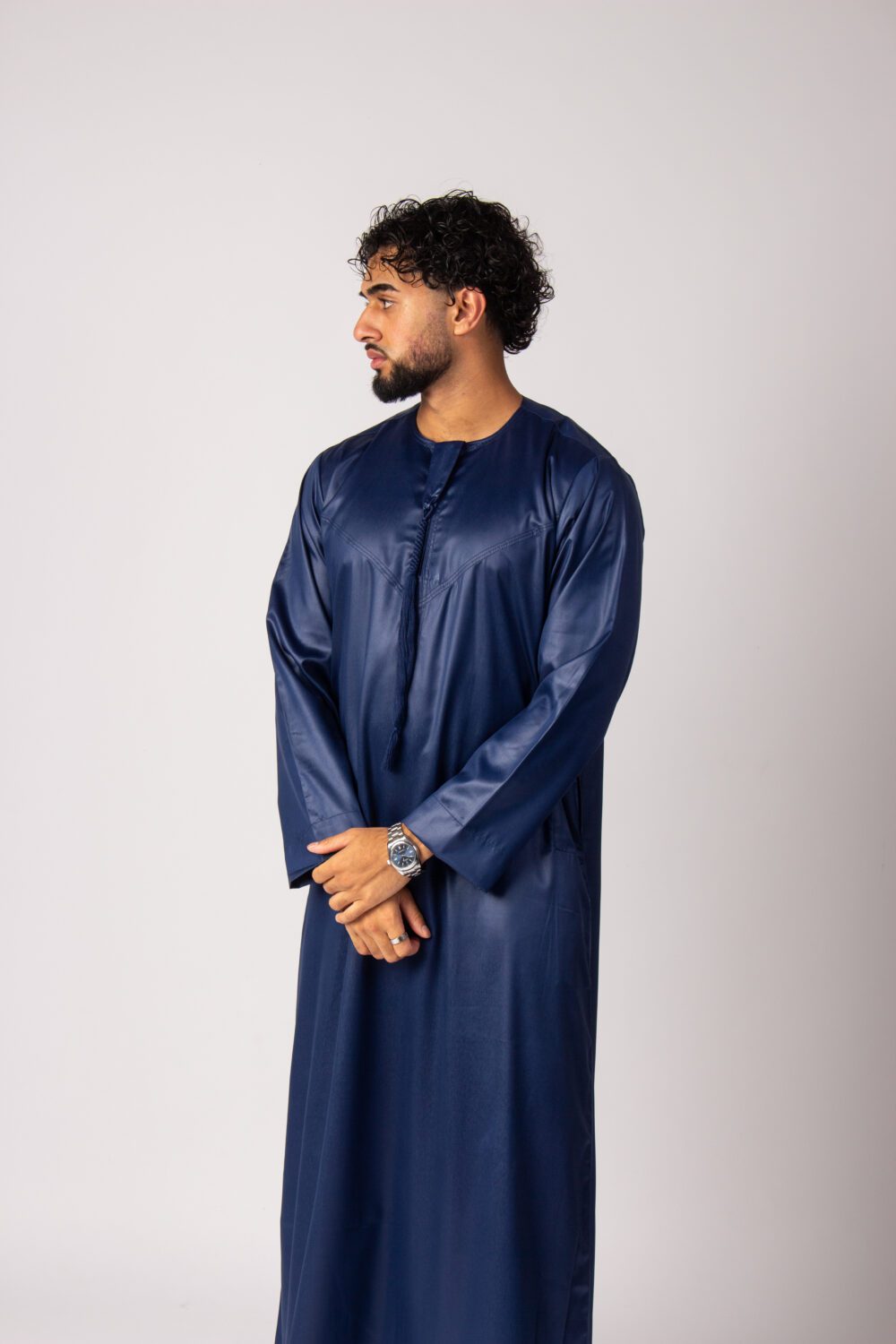 Shiny Dark Blue Mens Emirati Thobe Looking Right