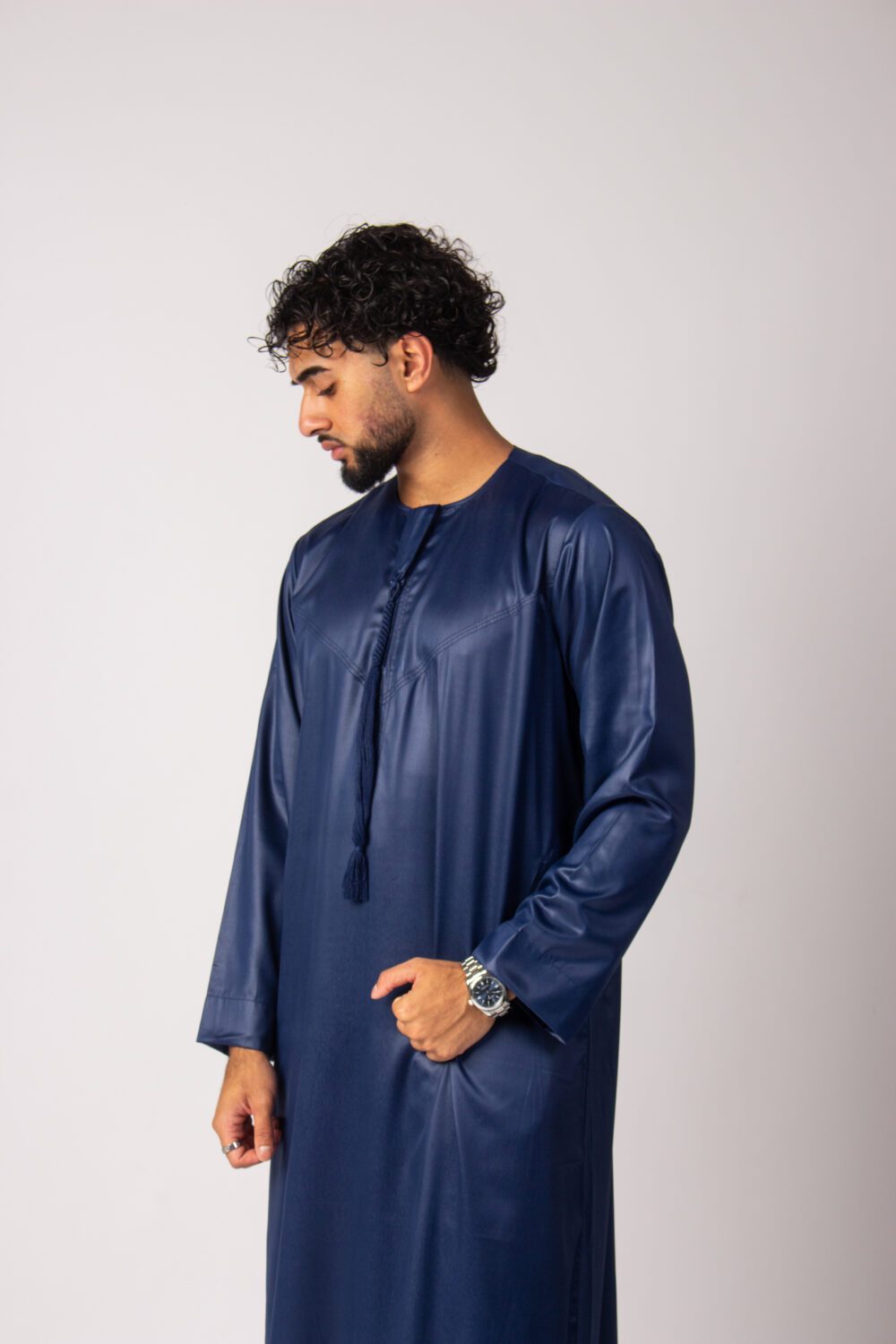 Shiny Dark Blue Mens Emirati Thobe Looking Down