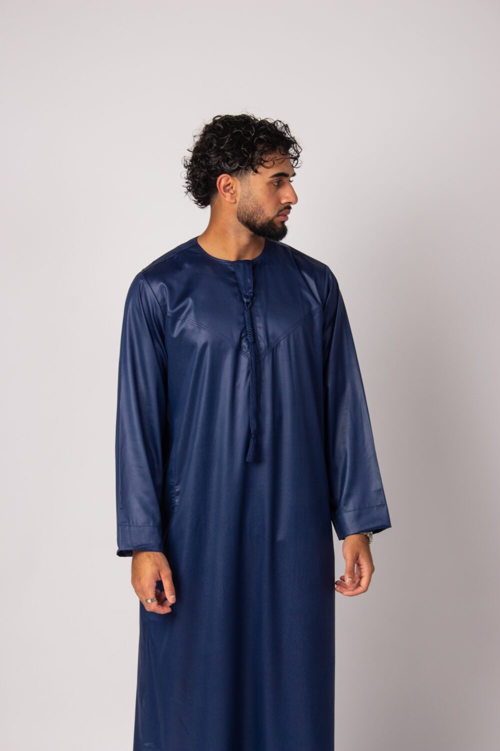 Shiny Dark Blue Mens Emirati Thobe Looking Left