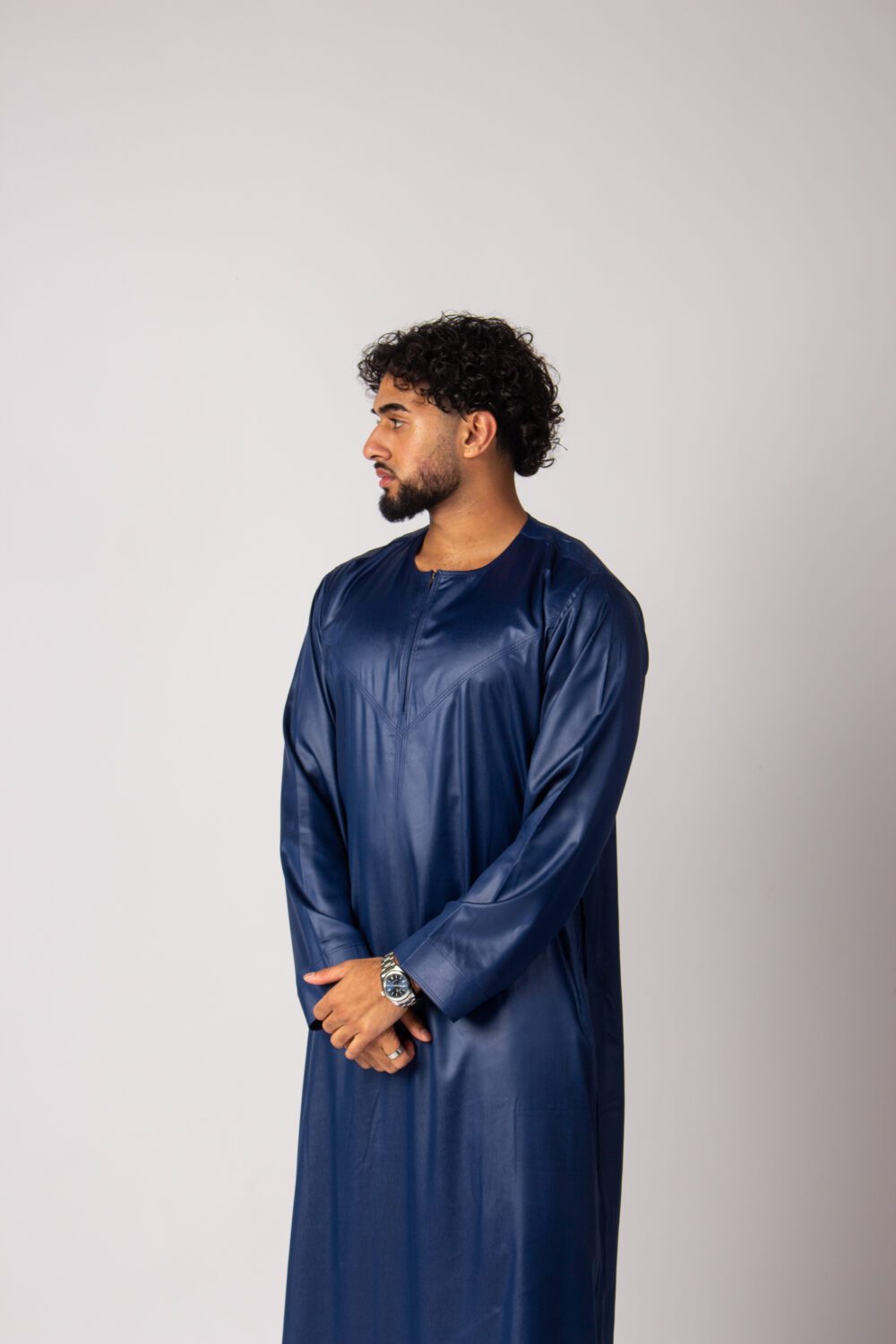 Shiny Dark Blue Mens Omani Thobe Looking Right