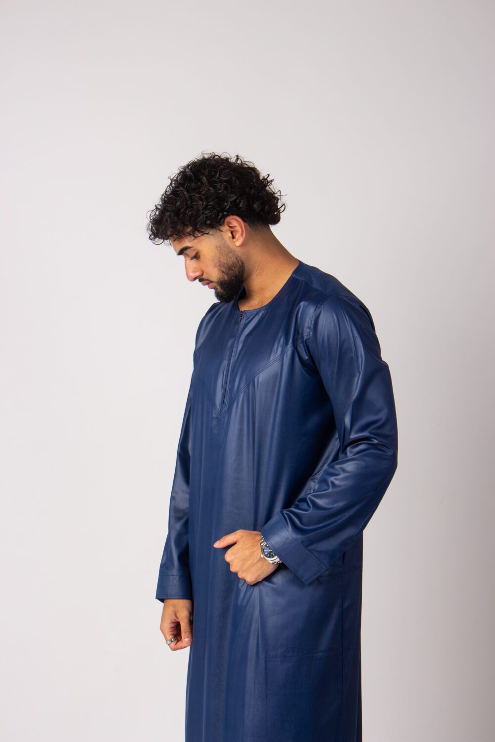 Shiny Dark Blue Mens Omani Thobe Looking Down