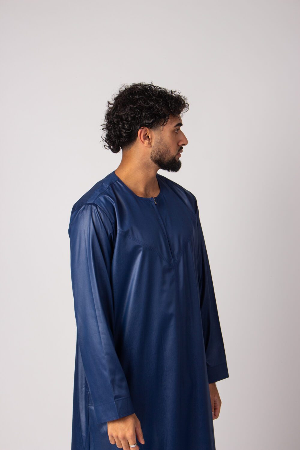 Shiny Dark Blue Mens Omani Thobe Looking Left