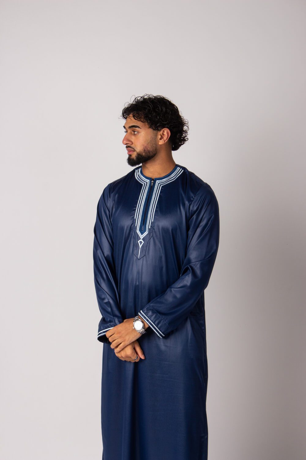 Shiny Dark Blue Mens Embroidery Thobe Looking Right