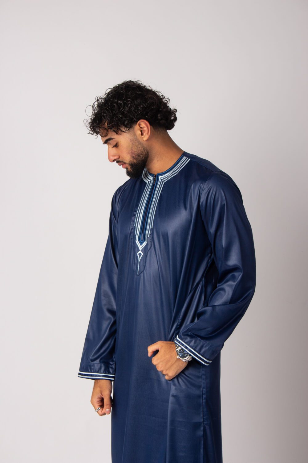 Shiny Dark Blue Mens Embroidery Thobe Looking Down