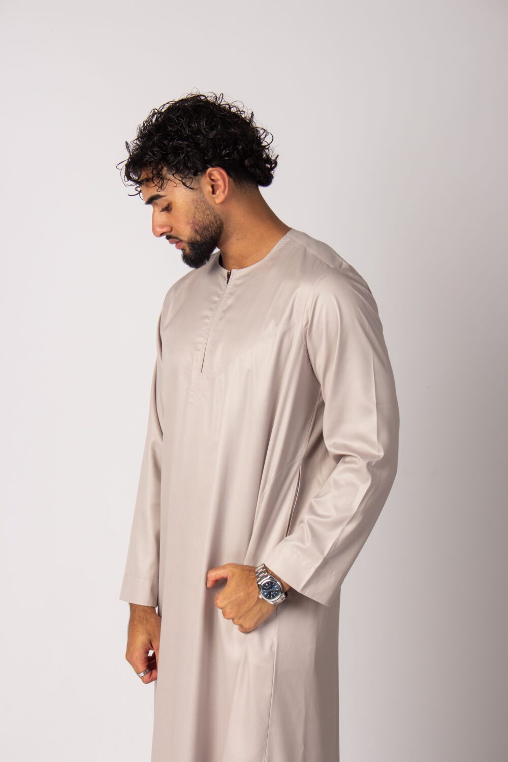 Shiny Beige Mens Omani Thobe Looking Down