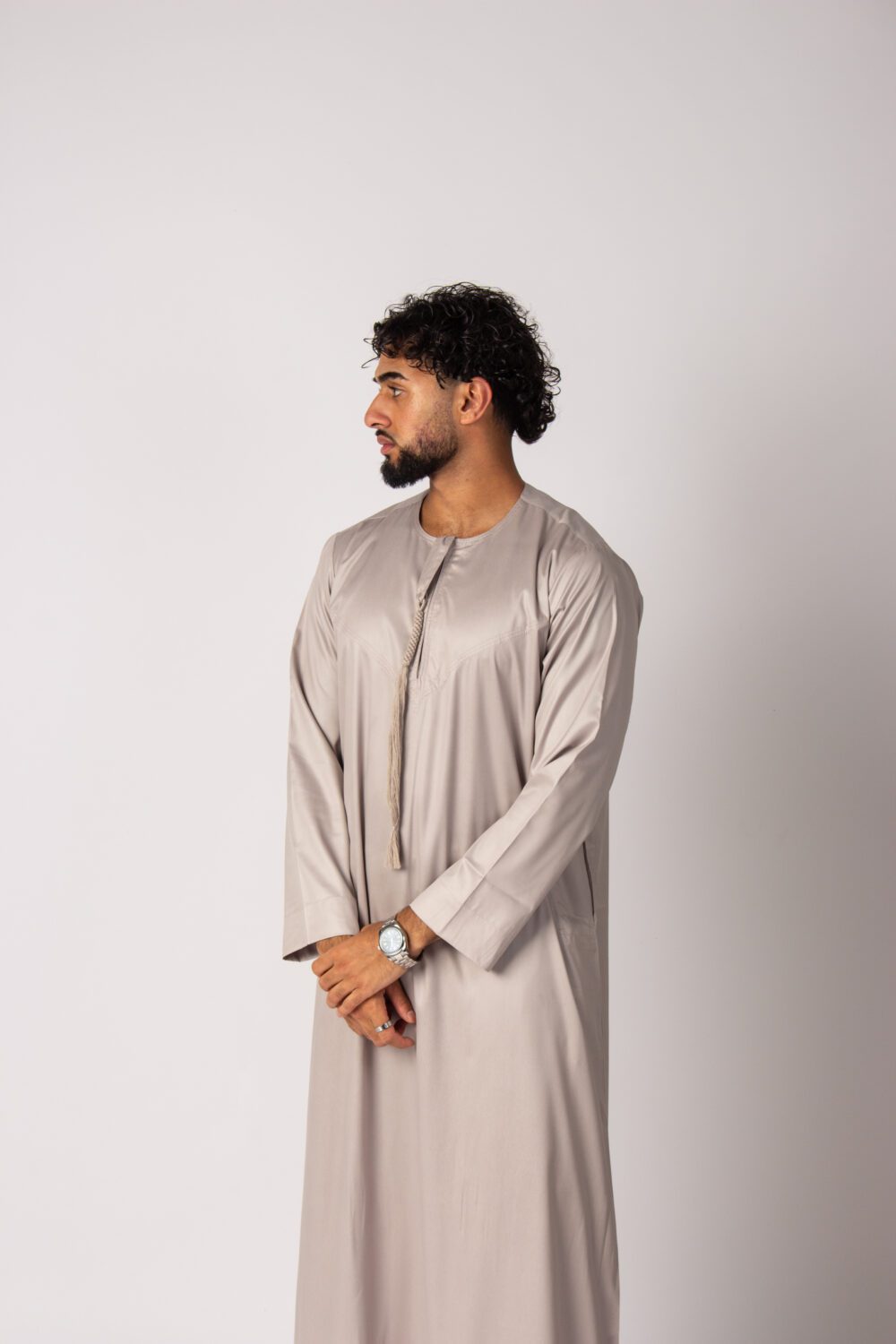 Shiny Beige Mens Emirati Thobe Looking Right